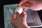 Peeling a boiled egg. A man is cleaning egg for breakfast