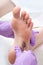 Peeling feet pedicure procedure with eletric device in the beauty salon