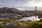 Peggy`s Cove Lighthouse at sunset with storm clouds