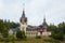 Peles Castle, residence of King Charles I in Sinaia, Romania. Autumn landscape of royal palace