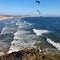 Pelicans soaring over Pacific Ocean at San Luis Obispo Bay in California