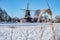 Pelmolen Ter Horst, Rijssen covered in snowy landscape in Overijssel Netherlands, historical wind mill during winter