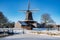 Pelmolen Ter Horst, Rijssen covered in snowy landscape in Overijssel Netherlands, historical wind mill during winter