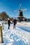 Pelmolen Ter Horst, Rijssen covered in snowy landscape in Overijssel Netherlands, historical wind mill during winter