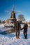 Pelmolen Ter Horst, Rijssen covered in snowy landscape in Overijssel Netherlands, historical wind mill during winter