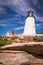 Pemaquid Point Lighthouse atop dramatic rocky coast