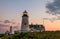 Pemaquid Point Lighthouse at sunset during a calm summer evening in Bristol, Maine