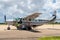 Pemba Domestic Airport apron with Auric Air local airline Cessna 208 Caravan aircraft loading baggage and preparing for flight.