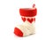 pen holder made of knitted yarn sock with red heart pattern and axis is a plastic cup isolated on white background
