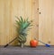 Pen-Pineapple-Apple-Pen on wooden background.