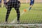 Penalty girl shooter and goalkeeper in a soccer field