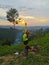 Penampang, Sabah Malaysia-9th March 2021. Unidentified Asian woman is pictured as if wanting to reach the sunset.