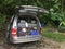 Penang, Malaysia - June 10, 2020 : A car with the back door open showing camping gears at a camp site at Penang Hill