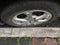 Penang, Malaysia - March 27, 2021 : View of a car wheel parking very near to a roadside kerb