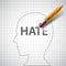 Pencil erases in the human head the word hate. Xenophobia and mi