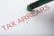 Pencil Erasing the Word `Tax Arrears` on Paper