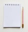 Pencil and white paper note book