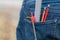 Pencils, compass and measuring instruments in back jeans pocket