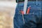 Pencils, compass and measuring instruments in back jeans pocket