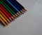 Pencils of different colors lined up
