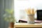 Pencils stand on a wooden table in a ray of sunlight.Office with shallow dof on background of working space