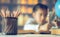 Pencils on a wooden table and asian child industrious is sitting at a desk . background. Educational background