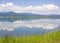 Pend Oreille River Reflection of Clouds, Selkirk Mountains and Western Lupine