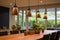 pendant lights over a teakwood dining table