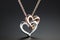 Pendant necklace two hearts entwined together