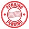 PENDING text written on red round postal stamp sign