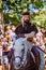 Penedono , Portugal / July 1, 2017 - Man rides horsebase dressed as a priest in Medieval fair