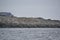 Penguin colonies resting on Antarctic rocky shorelines