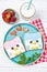 Penguin toasts with coloured spread on a plate, food for kids idea