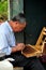 Pengzhou, China: Beekeeper Extracting Honey