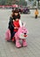 Pengzhou, China: Child with Mother Riding Bunny Cart