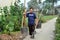 Pengzhou, China: Farmer Carrying Water Buckets