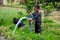 Pengzhou, China: Farmer Watering Field