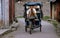 Pengzhou, China: Man Driving Bicycle Taxi
