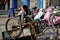 Pengzhou, China: Man Repairing Bicycle Cart