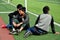 Pengzhou, China: Three Youths Watching Sports