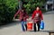 Pengzhou, China: Two Women Carrying Bucket