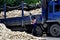 Pengzhou, China: Worker with Daikon Radishes