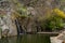 Penha Garcia historic village waterfall and Pego river beach on a cloudy day, in Portugal