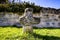 Penitence cross with old medieval abbey wall