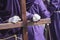 Penitent dressed in purple tunic of velvet resting on wooden