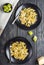 Penne pasta with romanesco cabbage on darck wooden background