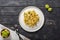 Penne pasta with romanesco cabbage on darck wooden background