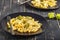 Penne pasta with romanesco cabbage on darck wooden background