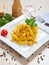 Penne with speck and saffron