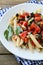 Penne with tomato and olive sauce